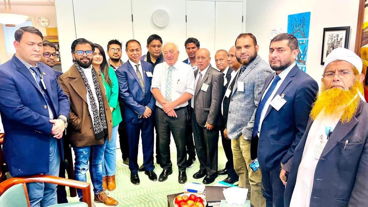 Formal group portrait with visiting delegates