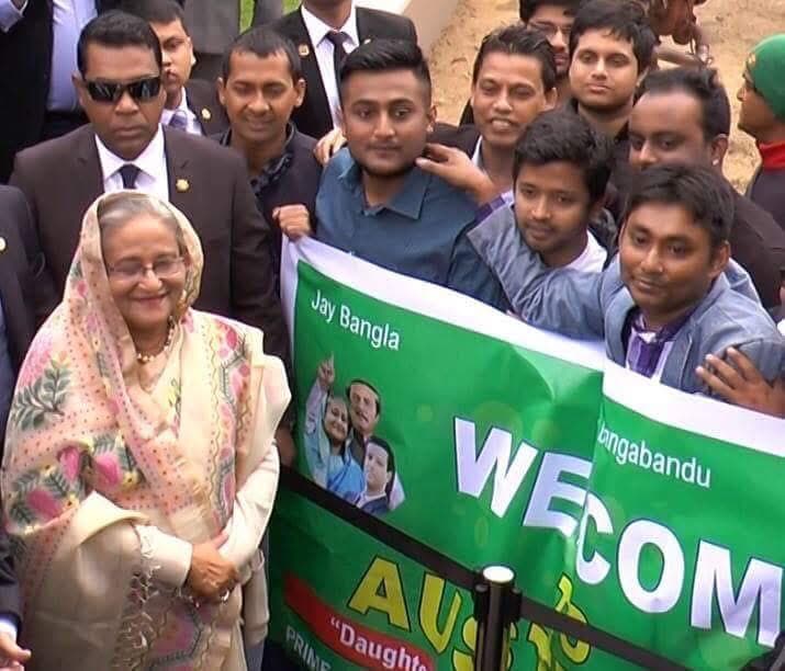 Community welcome with Jay Bangla banner
